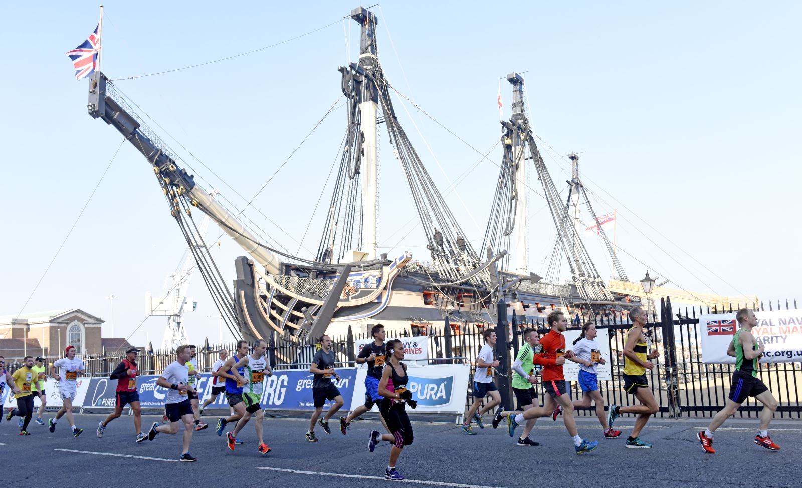 Runners passing HMS Victory during the Great South Run